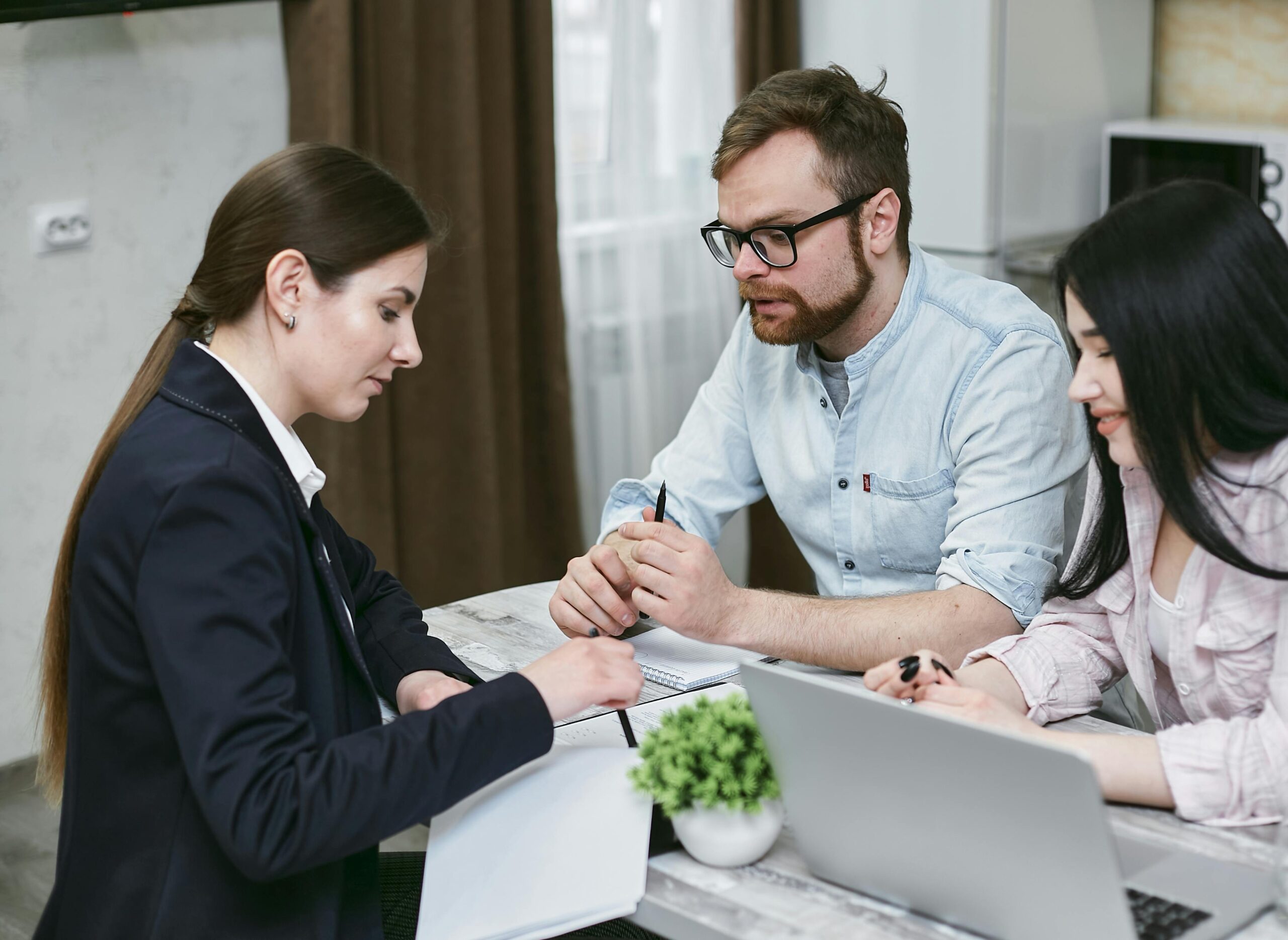 Image of a family reviewing home financing documents together in their living room.